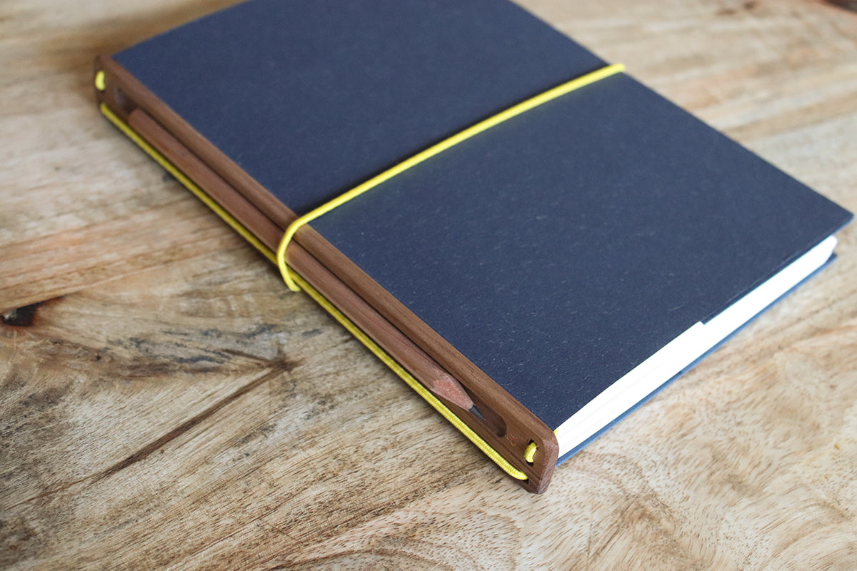 the one with the pencil. a5, navy & yellow